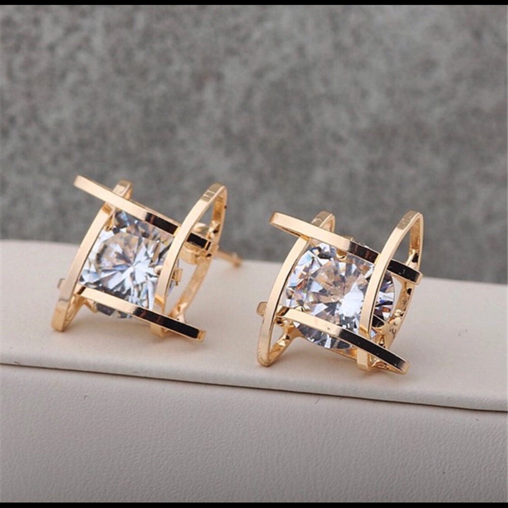 Square gold tone earrings with crystal stone
